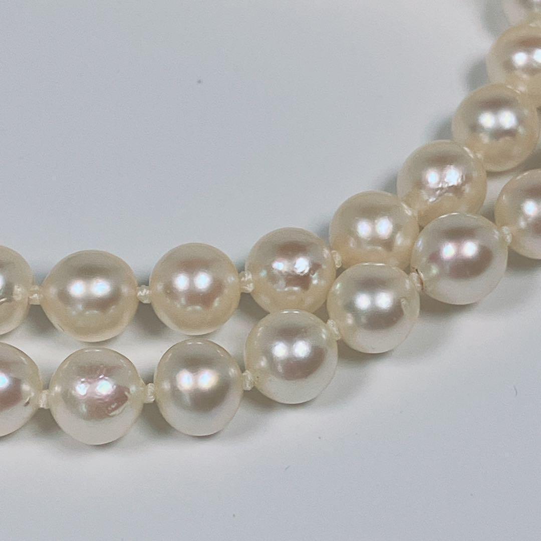 Akoya pearl necklace with 5.8 to 6.3mm pearls and silver clasp on a white background
