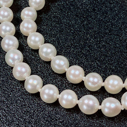 Akoya pearl necklace with 5.8 to 6.3mm pearls and silver clasp on a white background
