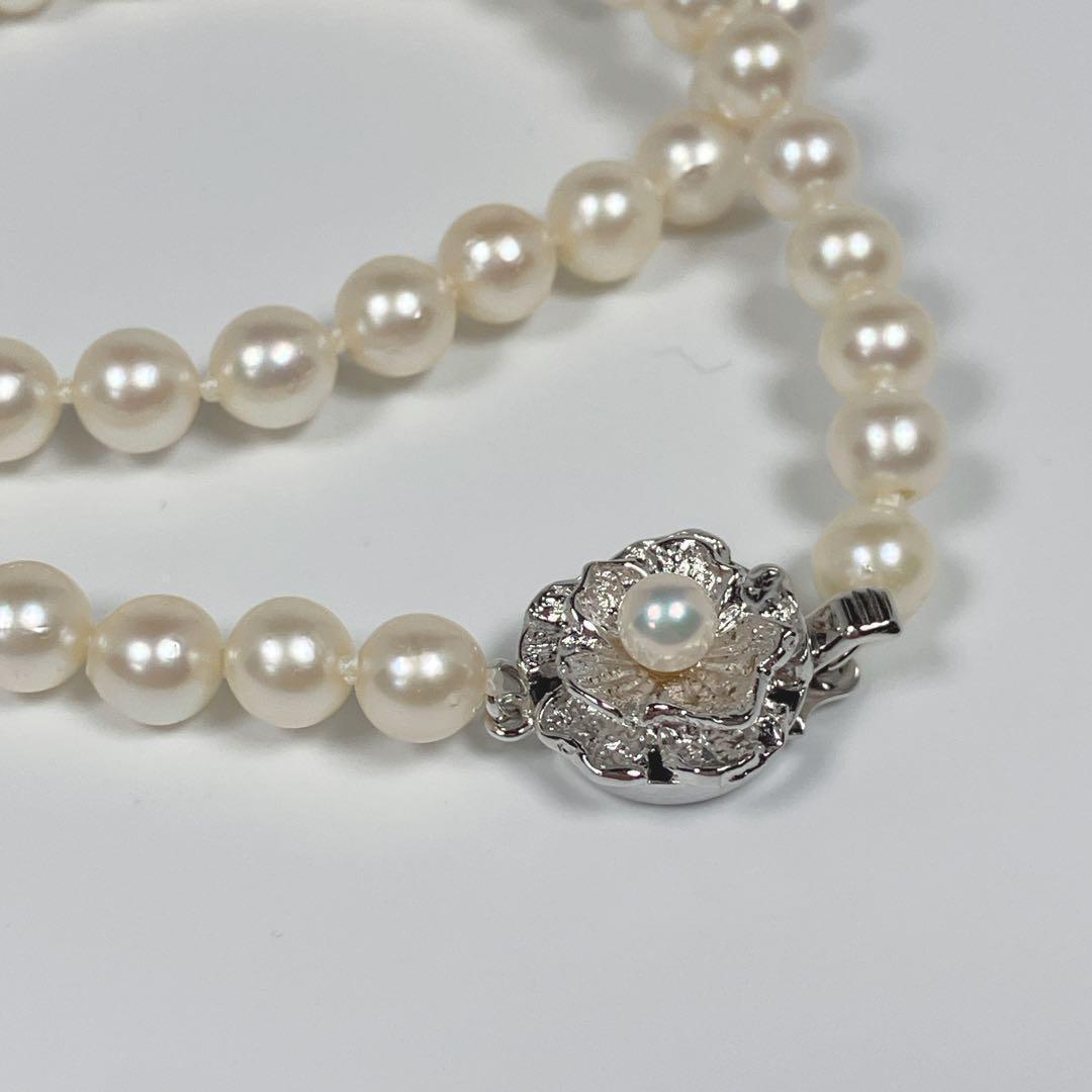 Akoya pearl necklace with 5.8 to 6.3mm pearls and silver clasp on a white background