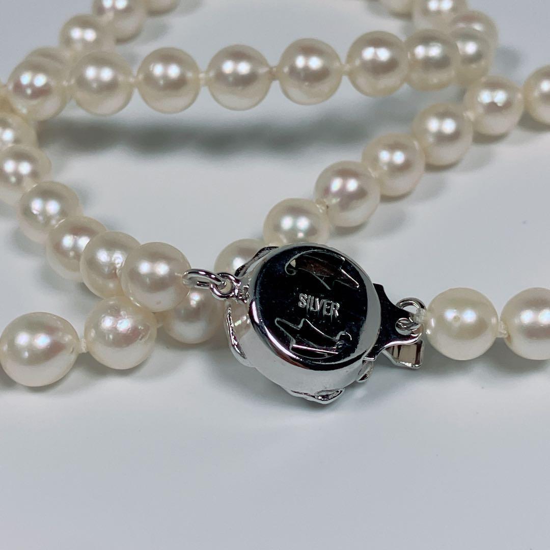 Akoya pearl necklace with 5.8 to 6.3mm pearls and silver clasp on a white background