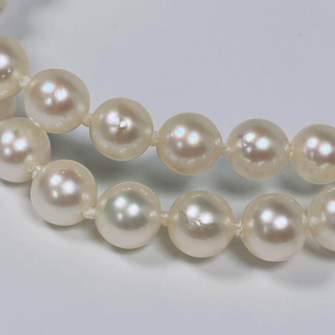 Akoya pearl necklace with 5.8 to 6.3mm pearls and silver clasp on a white background