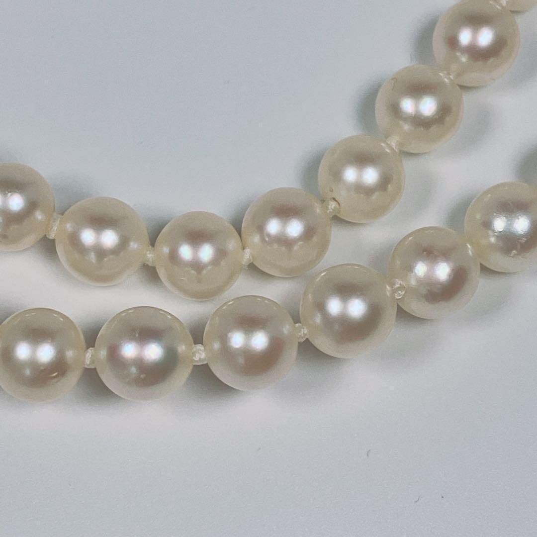 Akoya pearl necklace with 5.8 to 6.3mm pearls and silver clasp on a white background
