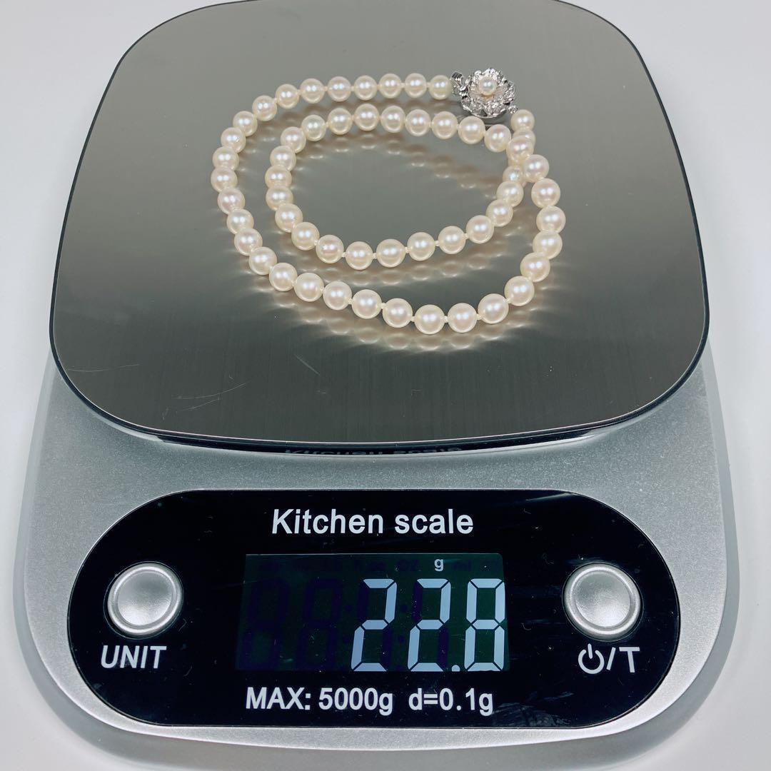Akoya pearl necklace with 5.8 to 6.3mm pearls and silver clasp on a white background