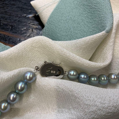 Tasaki Akoya gray pearl necklace and matching blue silver earrings set with rainbow luster