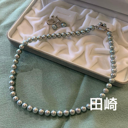 Tasaki Akoya gray pearl necklace and matching blue silver earrings set with rainbow luster