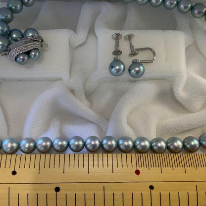 Tasaki Akoya gray pearl necklace and matching blue silver earrings set with rainbow luster
