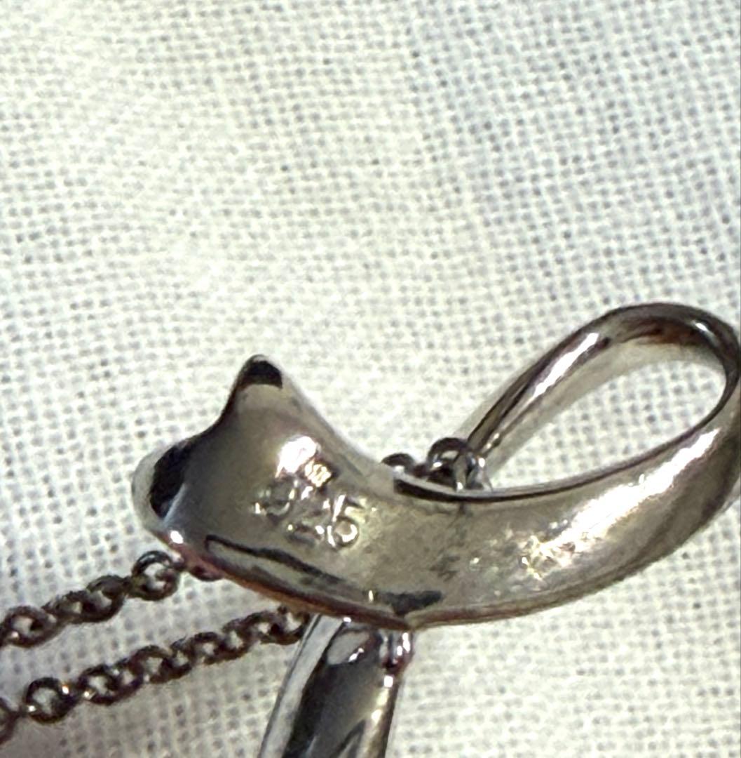 Mikimoto pearl necklace with a 44.6cm silver chain displayed on a white background