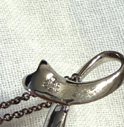 Mikimoto pearl necklace with a 44.6cm silver chain displayed on a white background