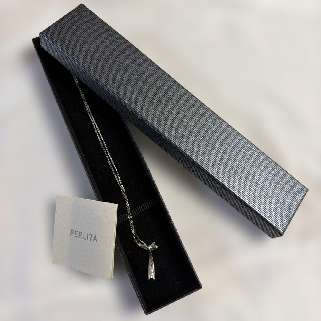 Mikimoto pearl necklace with a 44.6cm silver chain displayed on a white background