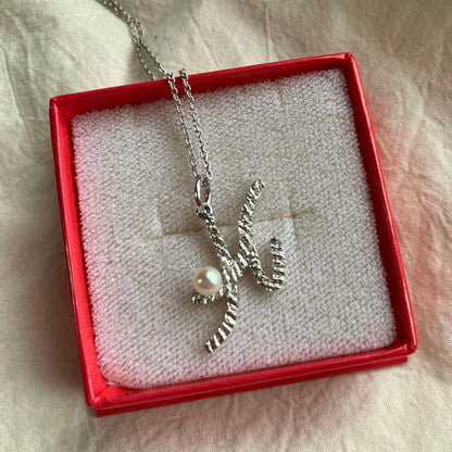 Tasaki silver pearl necklace with lustrous pearls and silver chain in excellent condition