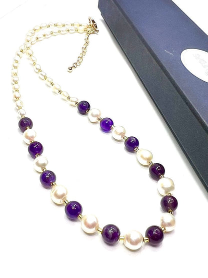Akoya pearl and amethyst necklace with K18 gold leaf parts on a white background