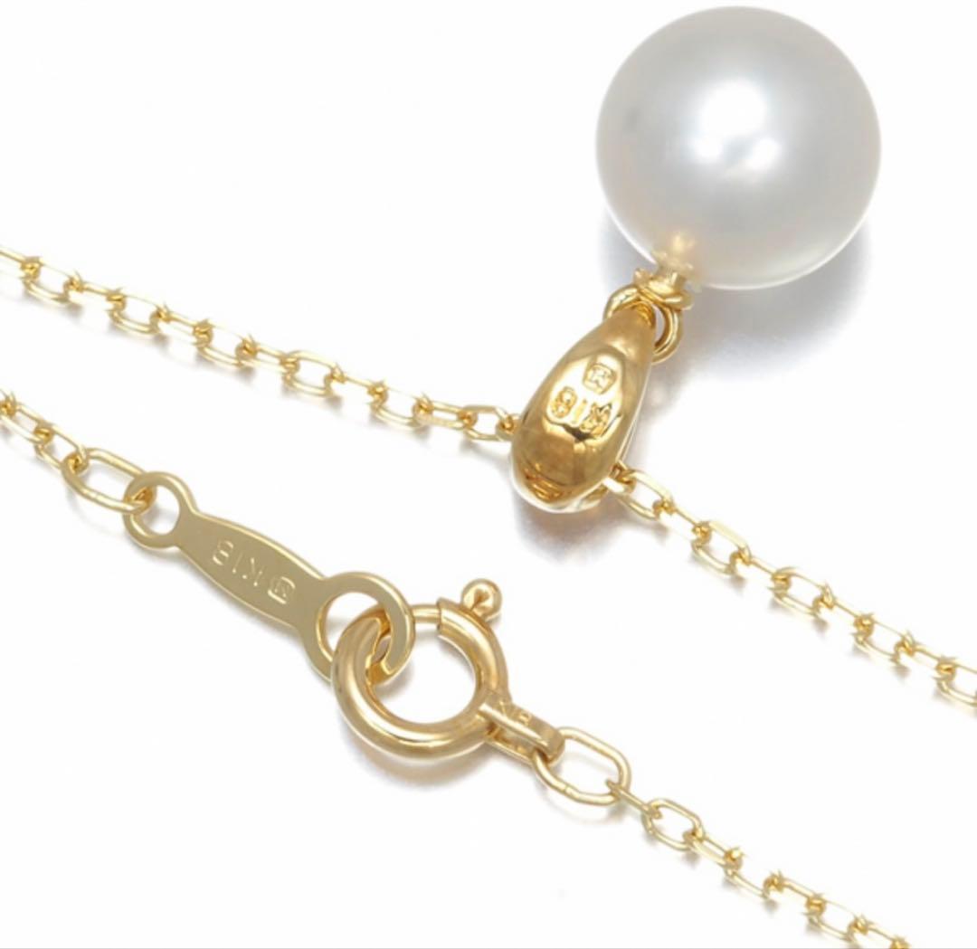 Mikimoto Akoya pearl necklace with a single round 8mm pearl on a yellow gold chain