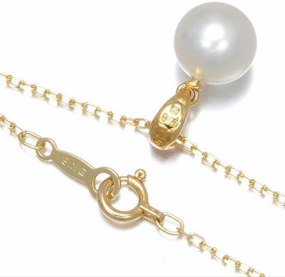 Mikimoto Akoya pearl necklace with a single round 8mm pearl on a yellow gold chain