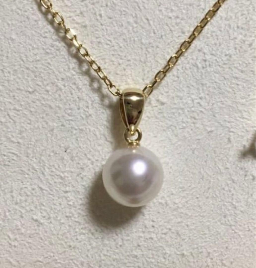 Mikimoto Akoya pearl necklace with a single round 8mm pearl on a yellow gold chain