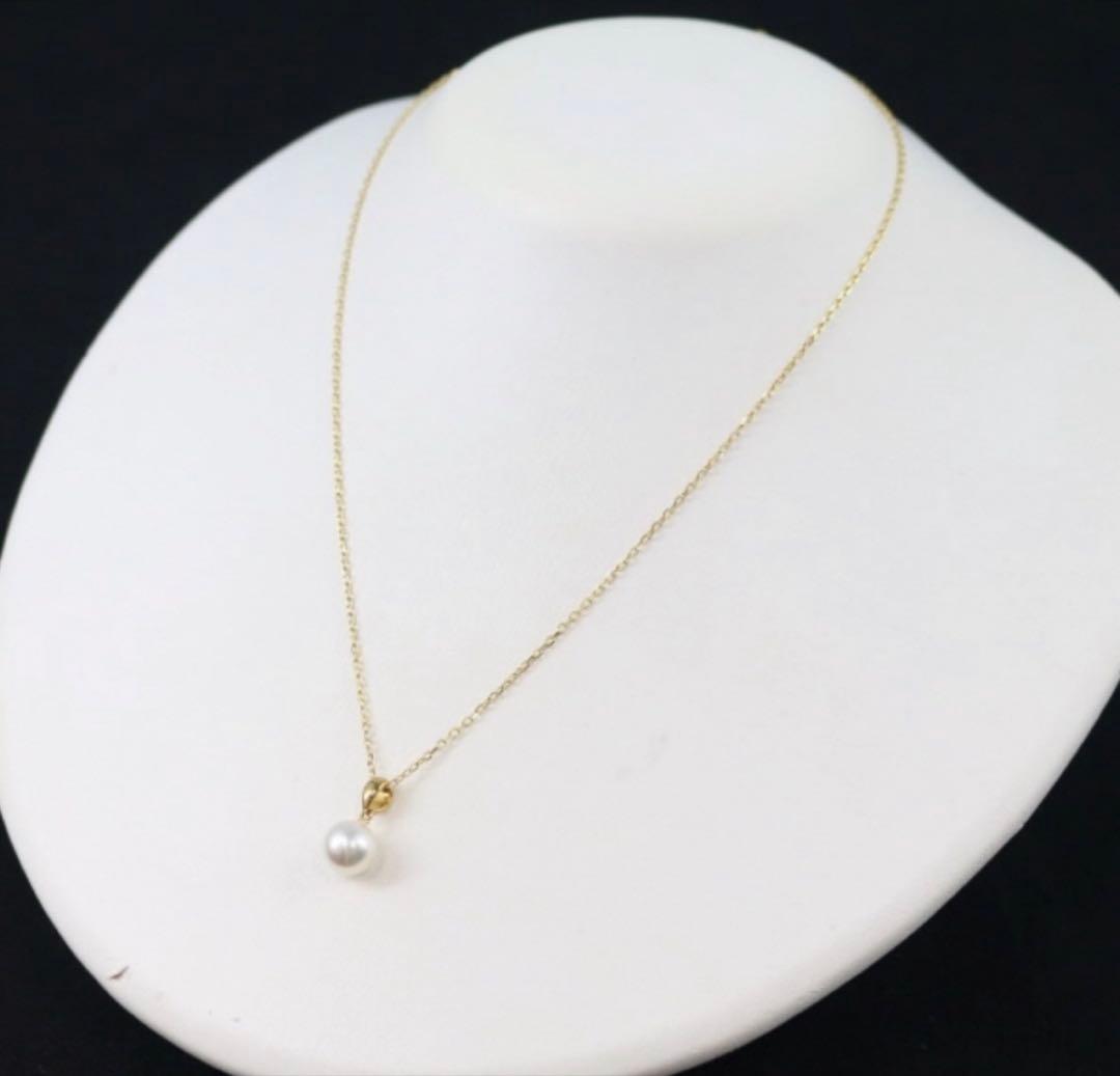Mikimoto Akoya pearl necklace with a single round 8mm pearl on a yellow gold chain
