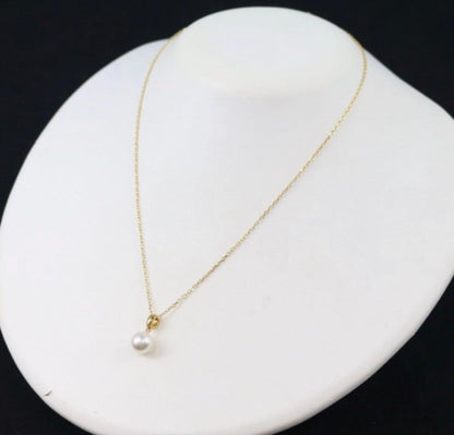Mikimoto Akoya pearl necklace with a single round 8mm pearl on a yellow gold chain