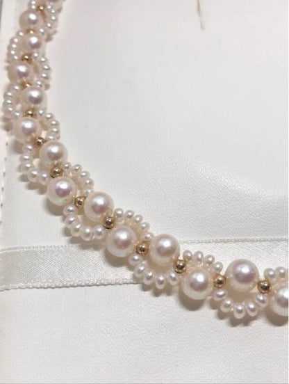 Akoya and freshwater pearl braided necklace with white pearls and silver clasp, approximately 43cm long
