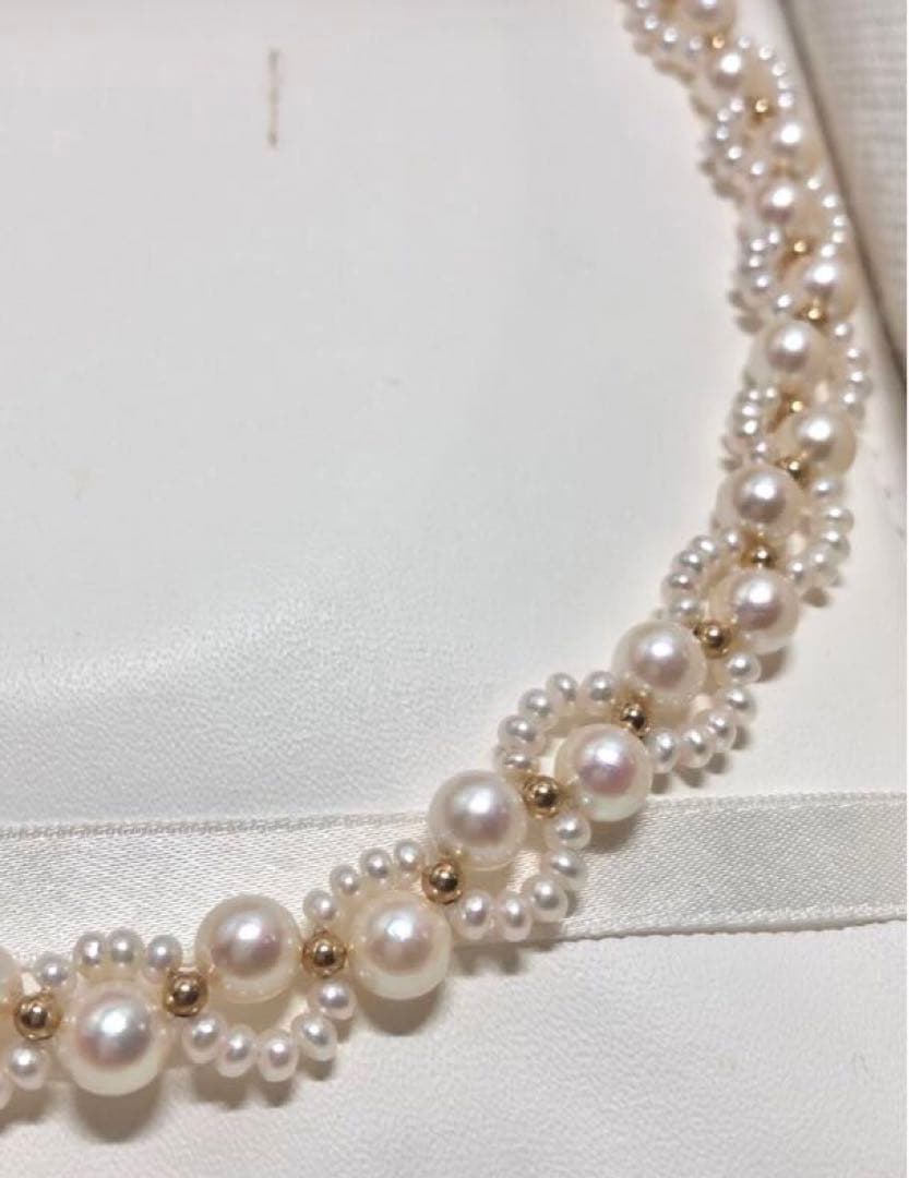 Akoya and freshwater pearl braided necklace with white pearls and silver clasp, approximately 43cm long