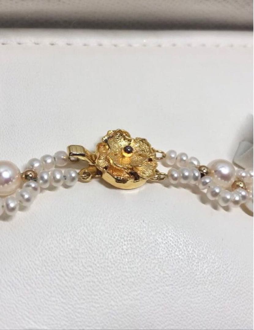 Akoya and freshwater pearl braided necklace with white pearls and silver clasp, approximately 43cm long
