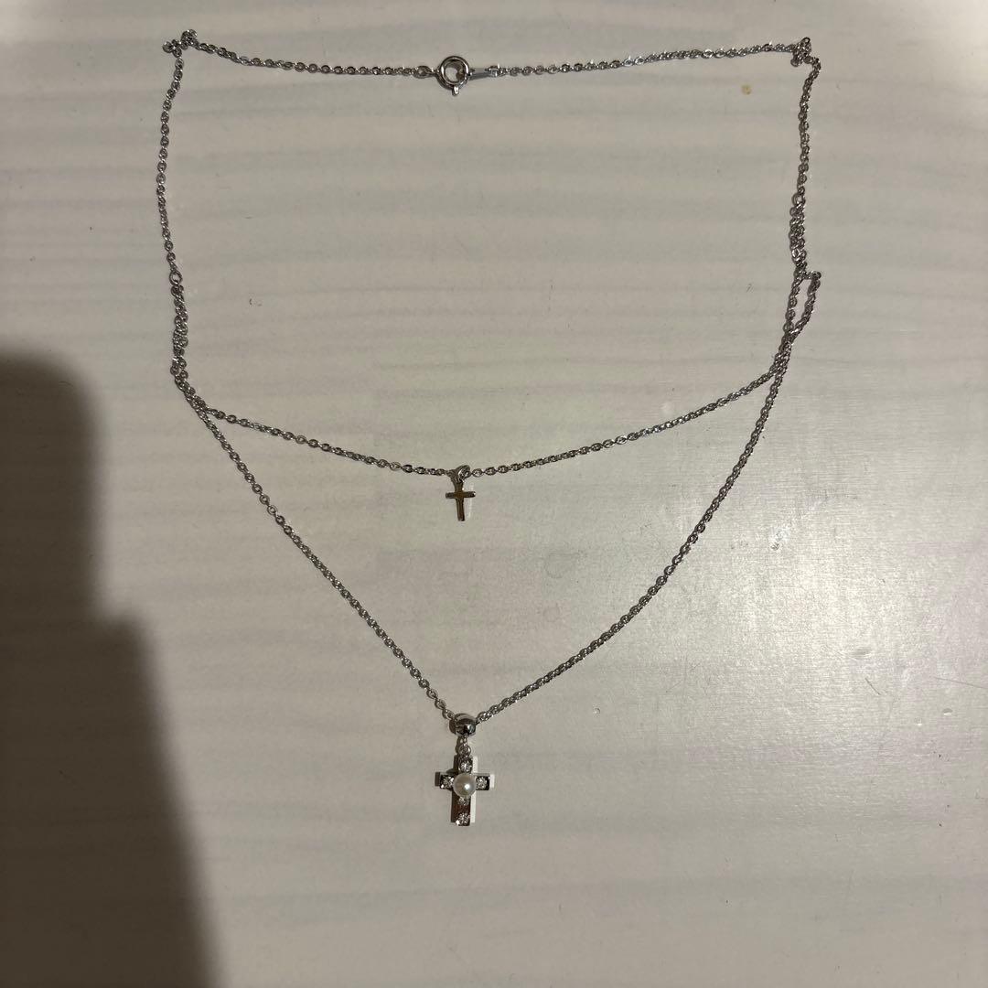 Mikimoto Pearl Island 2-strand silver necklace featuring a cross pendant decorated with pearls and rhinestones