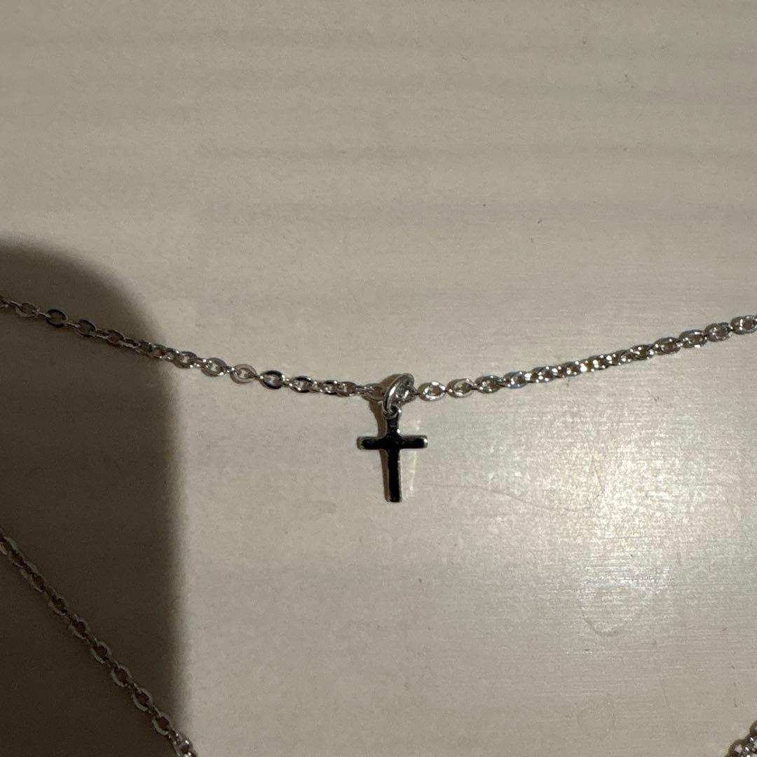 Mikimoto Pearl Island 2-strand silver necklace featuring a cross pendant decorated with pearls and rhinestones