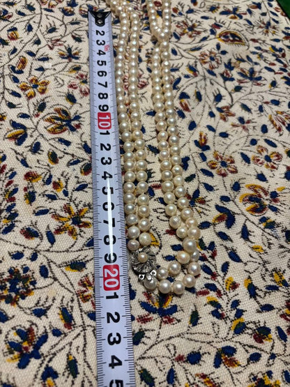Honest Pearl 2-strand Akoya pearl necklace with silver stamped clasp on white background