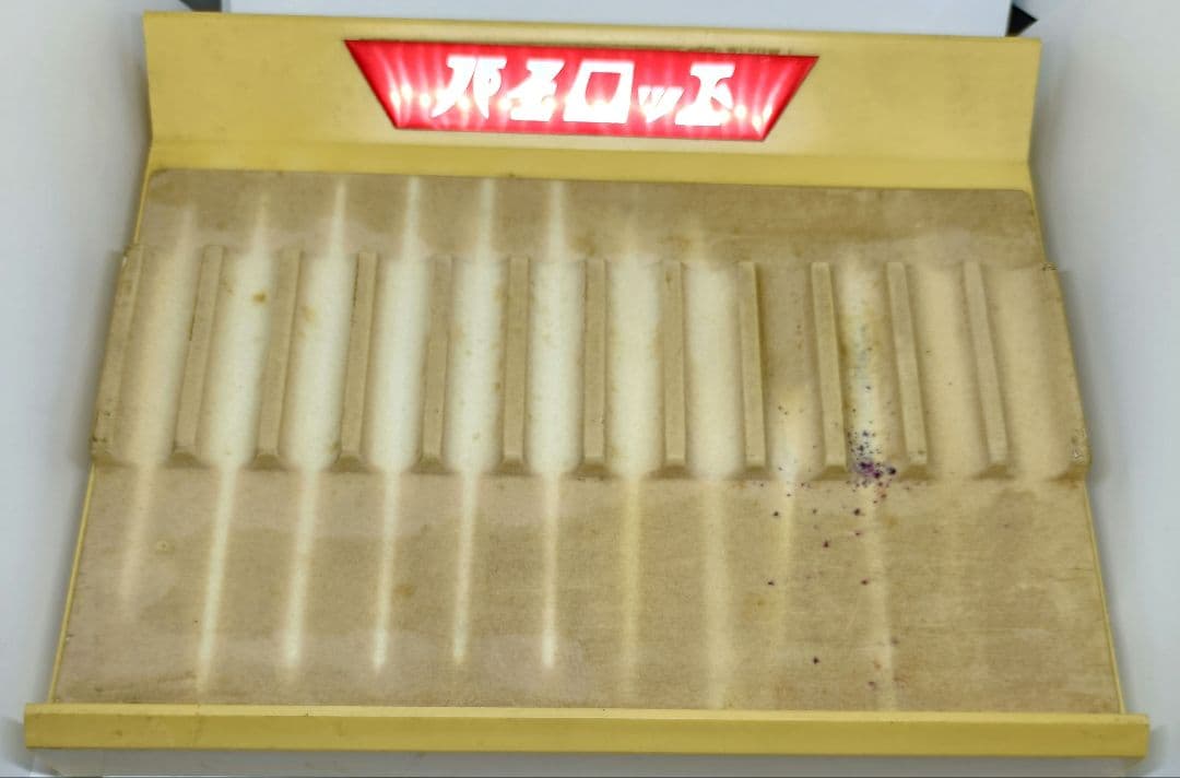 White and red Pilot pen tray with sunburned and heavily stained surface