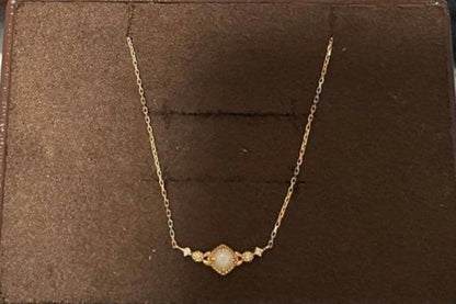 Agete Opal Necklace featuring 10 karat gold chain and diamond decoration