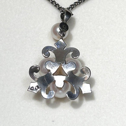 Mikimoto Akoya Pearl Necklace with 6mm pearls, 40cm length, weighing 5g, displayed on white background