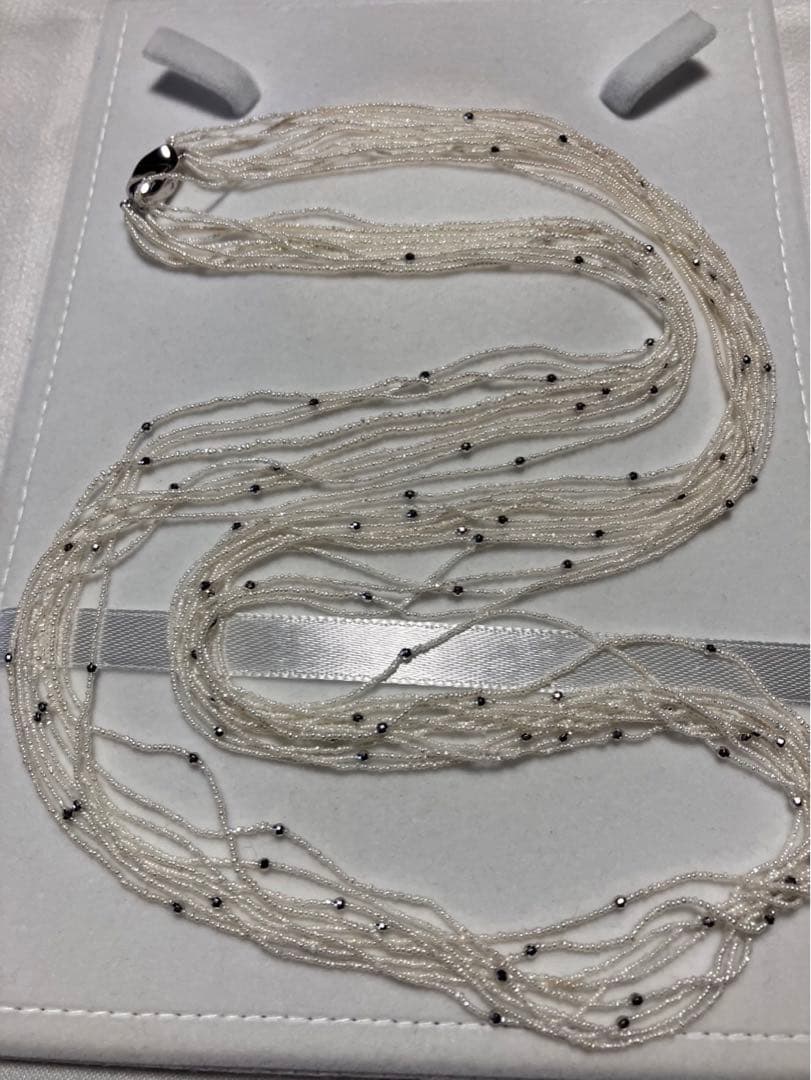 Akoya pearl 10-strand long necklace with small Keshi pearls and k18 white gold mirror-cut balls