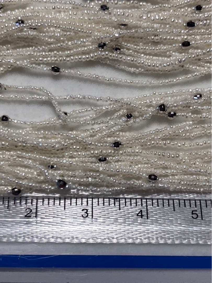 Akoya pearl 10-strand long necklace with small Keshi pearls and k18 white gold mirror-cut balls