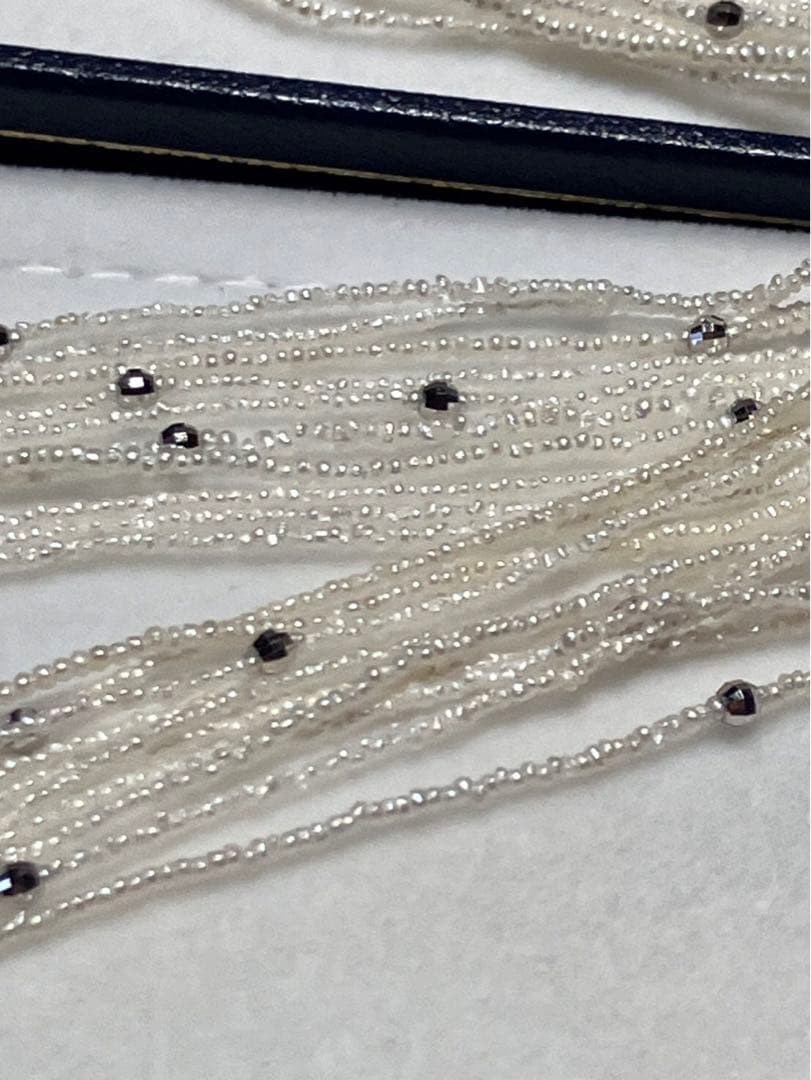 Akoya pearl 10-strand long necklace with small Keshi pearls and k18 white gold mirror-cut balls