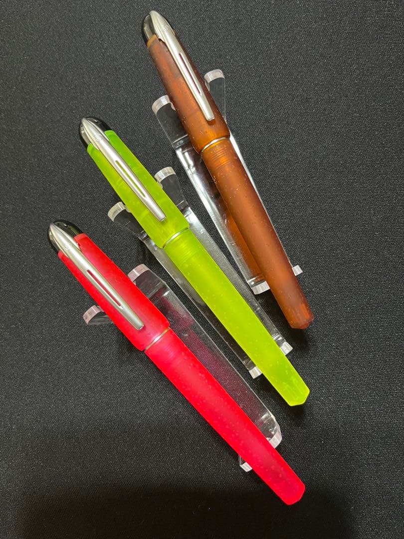 Three Waterman Cultuur Light Soft fountain pens in pink, yellow, and amber with ink cartridges included in original box