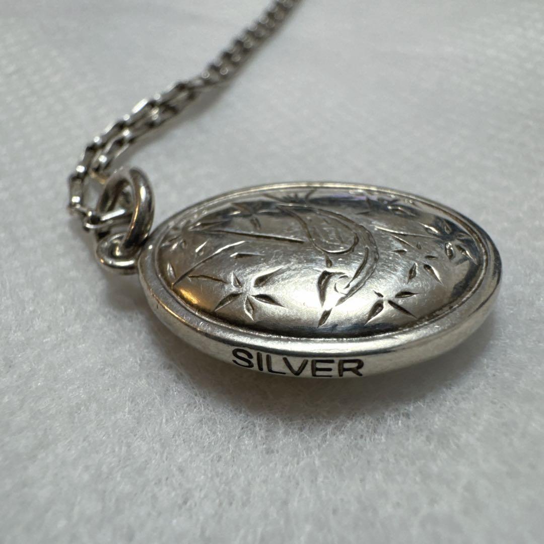agete silver pendant charm featuring white pearl shell with included 925 silver chain