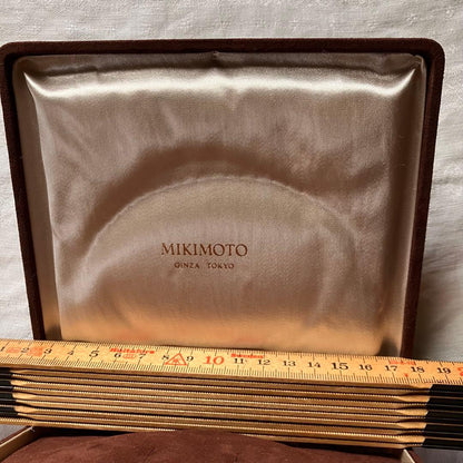 MIKIMOTO pearl choker necklace with 63 round pearls and silver M engraved clasp displayed with original box