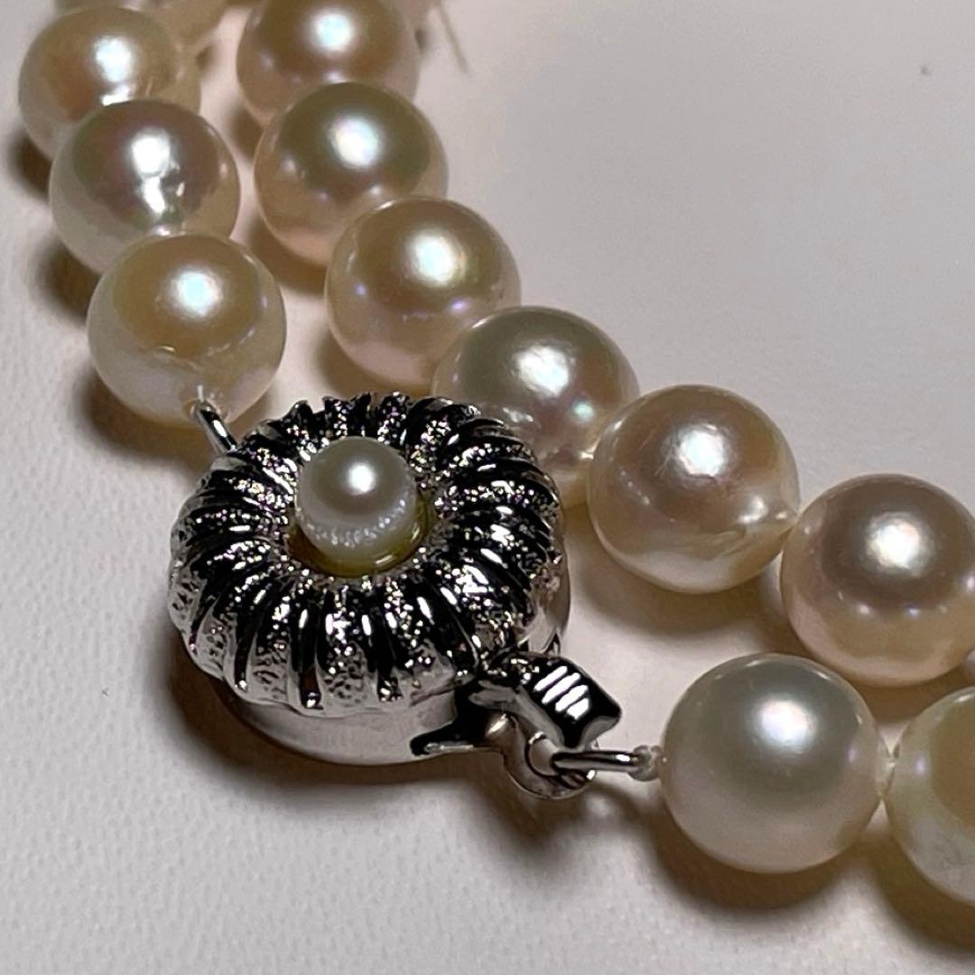 Oyster Akoya pearl necklace with 7.0-7.4mm white round pearls on 42.6cm silver chain marked SILVER