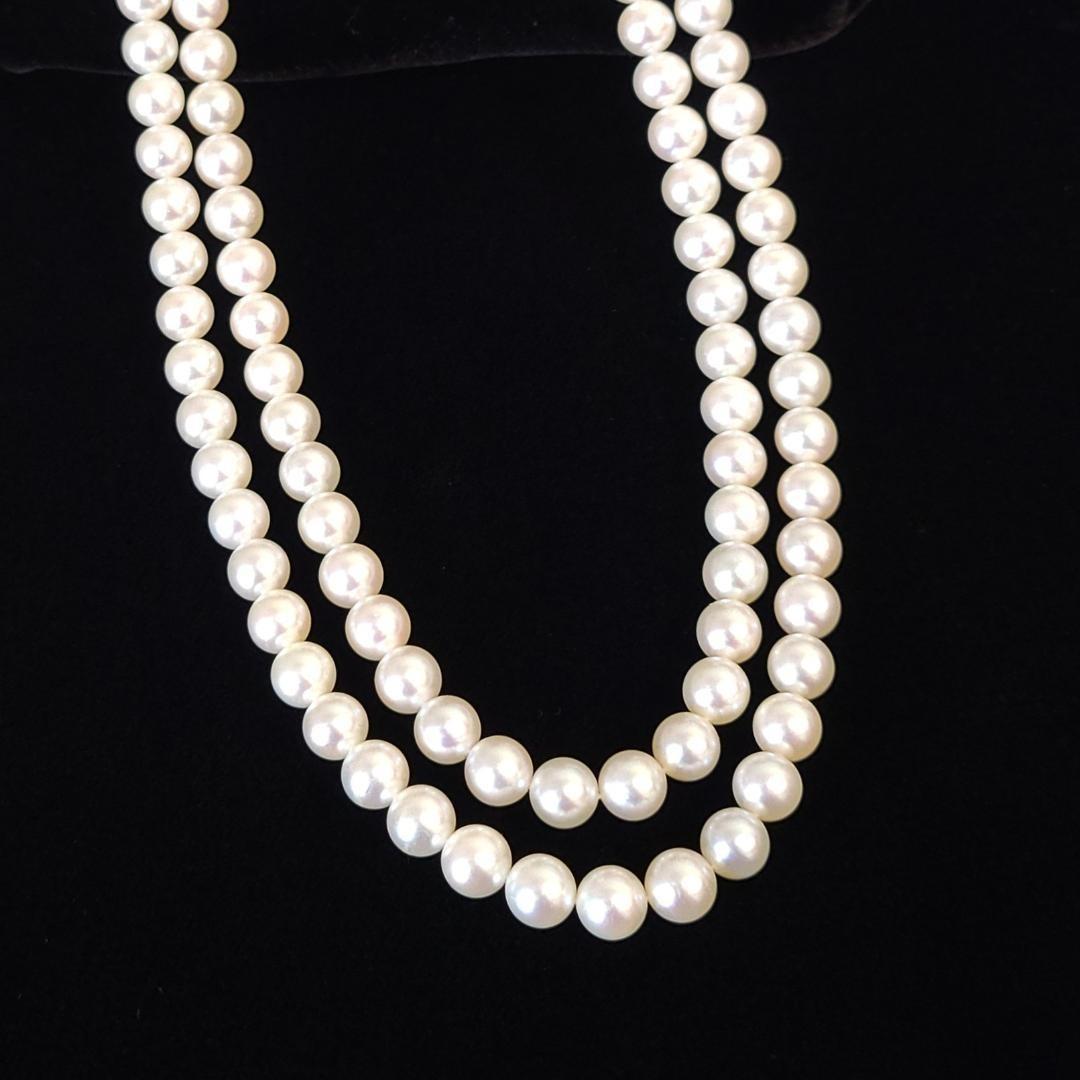 Akoya pearl long necklace with 6mm pearls measuring 80cm in length on a white background