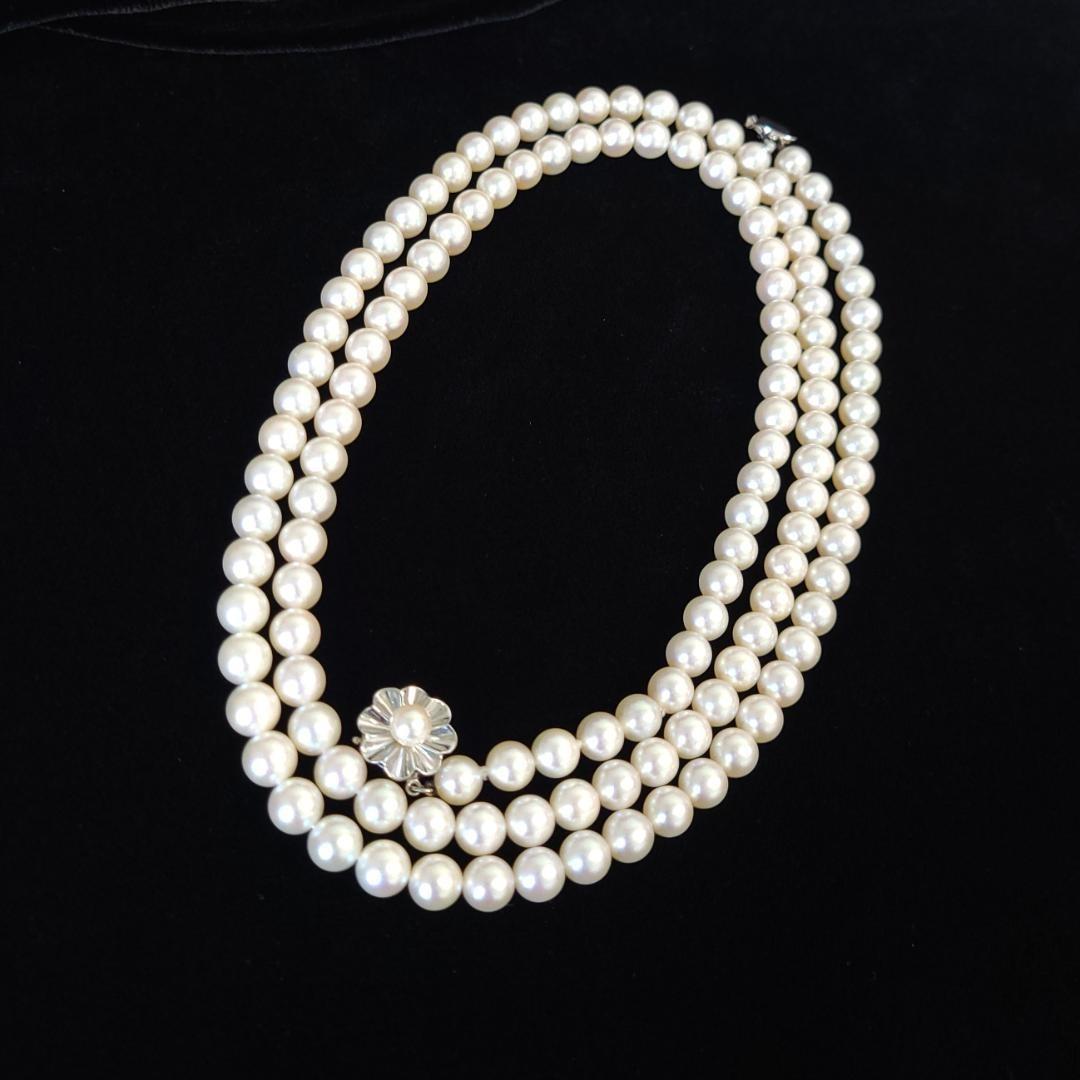 Akoya pearl long necklace with 6mm pearls measuring 80cm in length on a white background