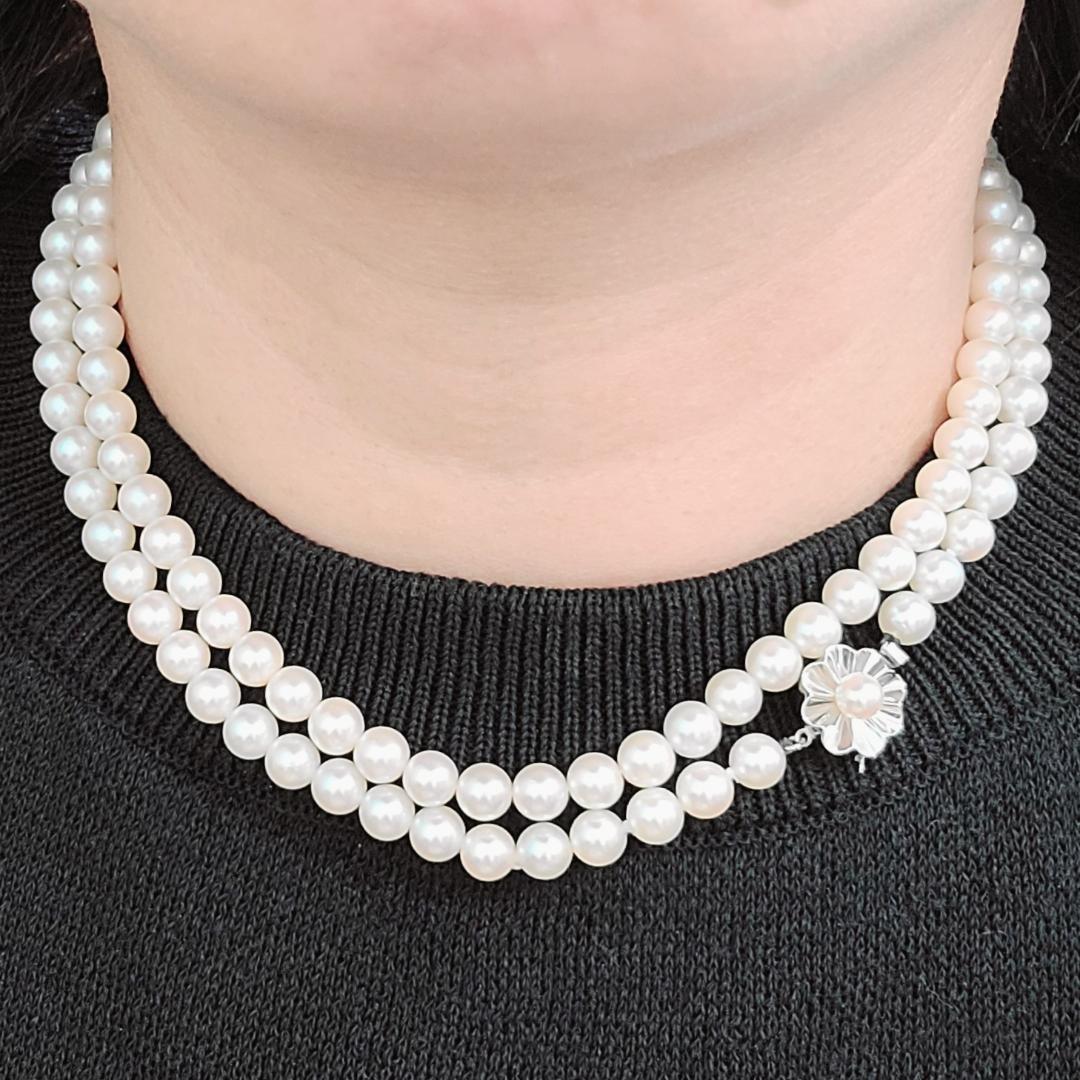 Akoya pearl long necklace with 6mm pearls measuring 80cm in length on a white background