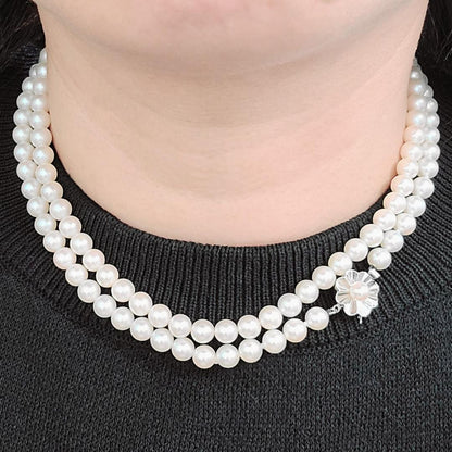 Akoya pearl long necklace with 6mm pearls measuring 80cm in length on a white background