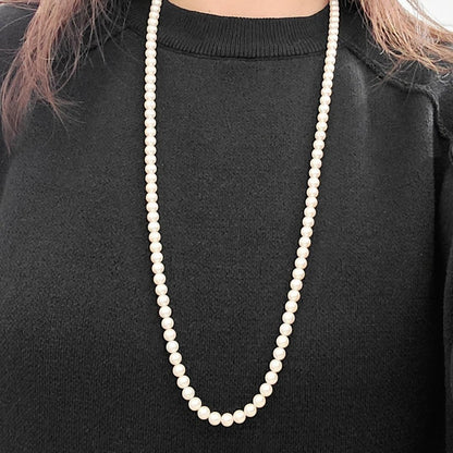 Akoya pearl long necklace with 6mm pearls measuring 80cm in length on a white background