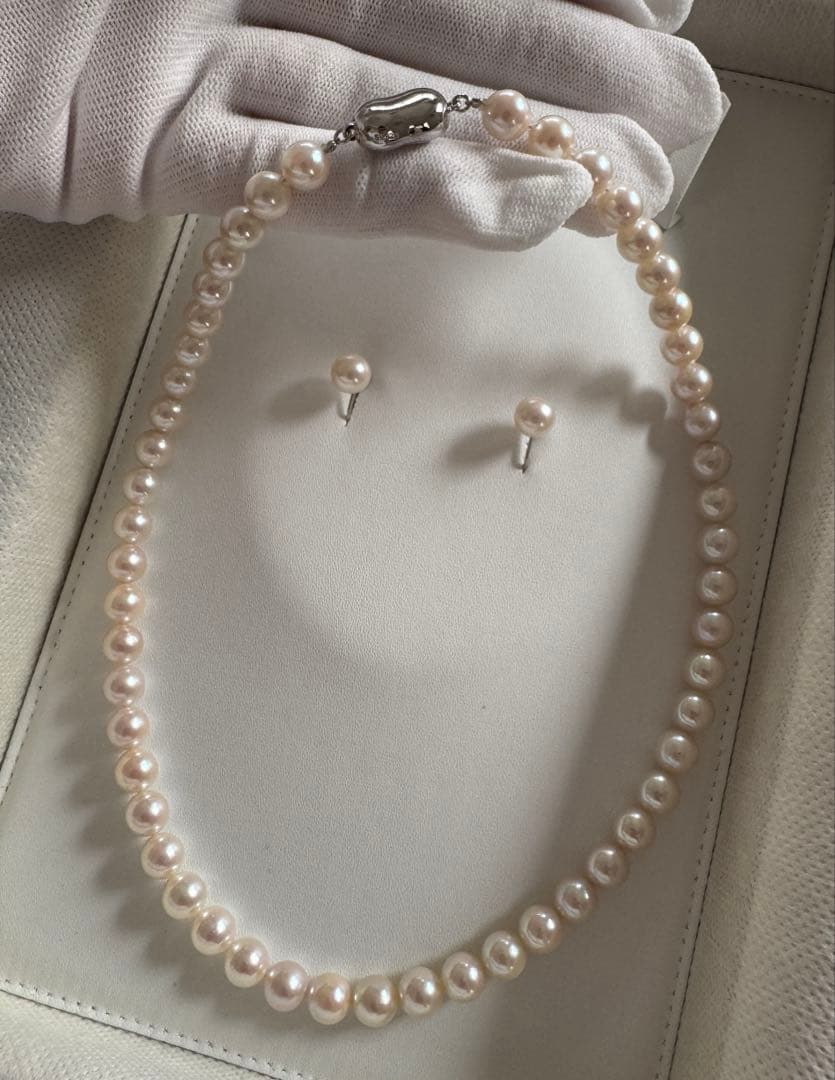 Akoya pearl necklace and earring set with round white pink Hanadama pearls and silver clasps