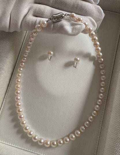 Akoya pearl necklace and earring set with round white pink Hanadama pearls and silver clasps