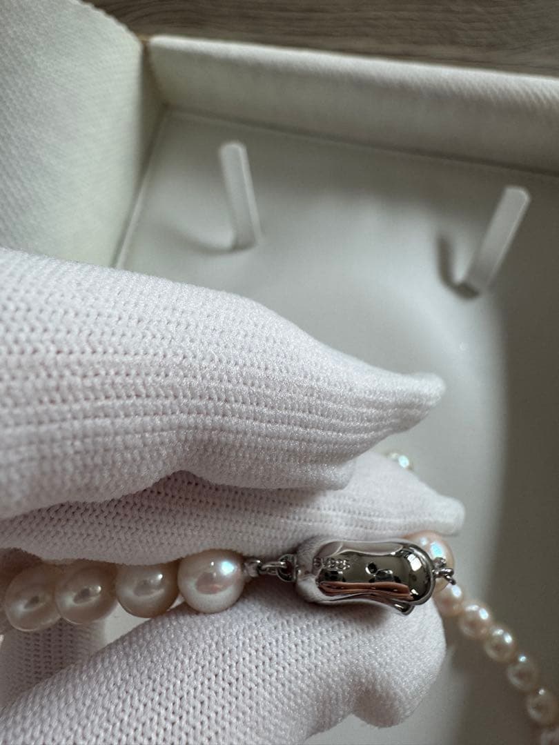 Akoya pearl necklace and earring set with round white pink Hanadama pearls and silver clasps