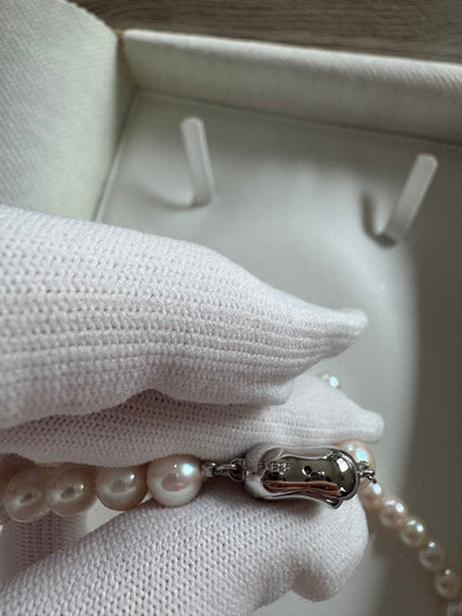 Akoya pearl necklace and earring set with round white pink Hanadama pearls and silver clasps