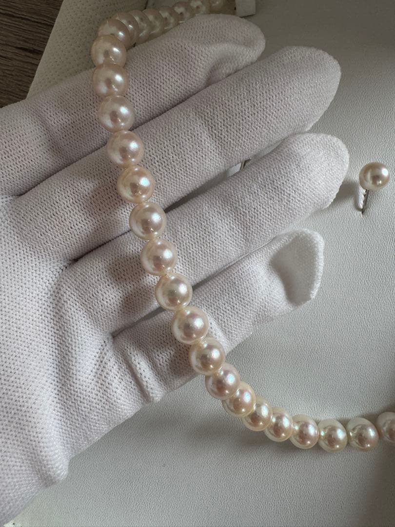 Akoya pearl necklace and earring set with round white pink Hanadama pearls and silver clasps