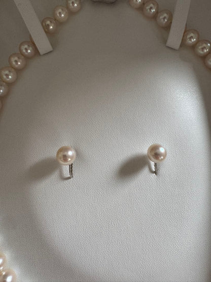 Akoya pearl necklace and earring set with round white pink Hanadama pearls and silver clasps