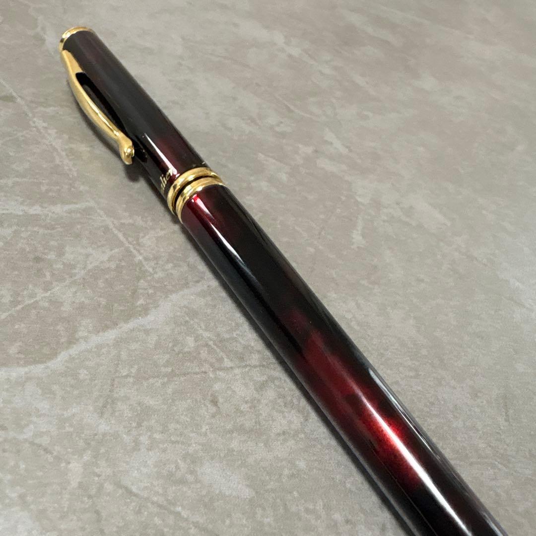 Pilot Cavalier fountain pen in dark brown with gold trim and capped nib on white background