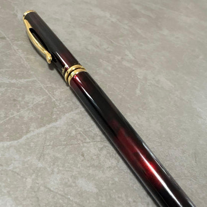 Pilot Cavalier fountain pen in dark brown with gold trim and capped nib on white background