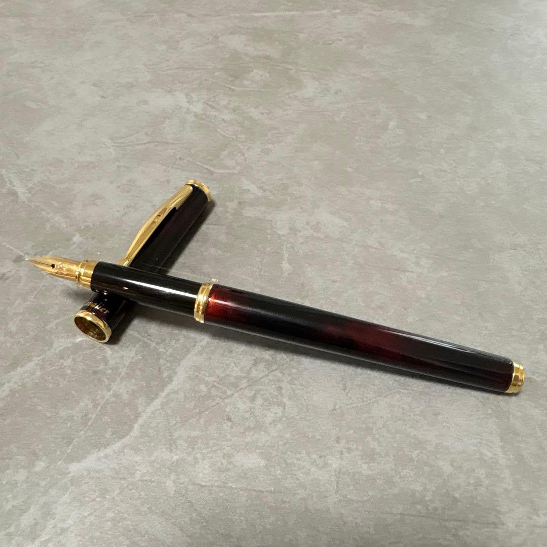 Pilot Cavalier fountain pen in dark brown with gold trim and capped nib on white background